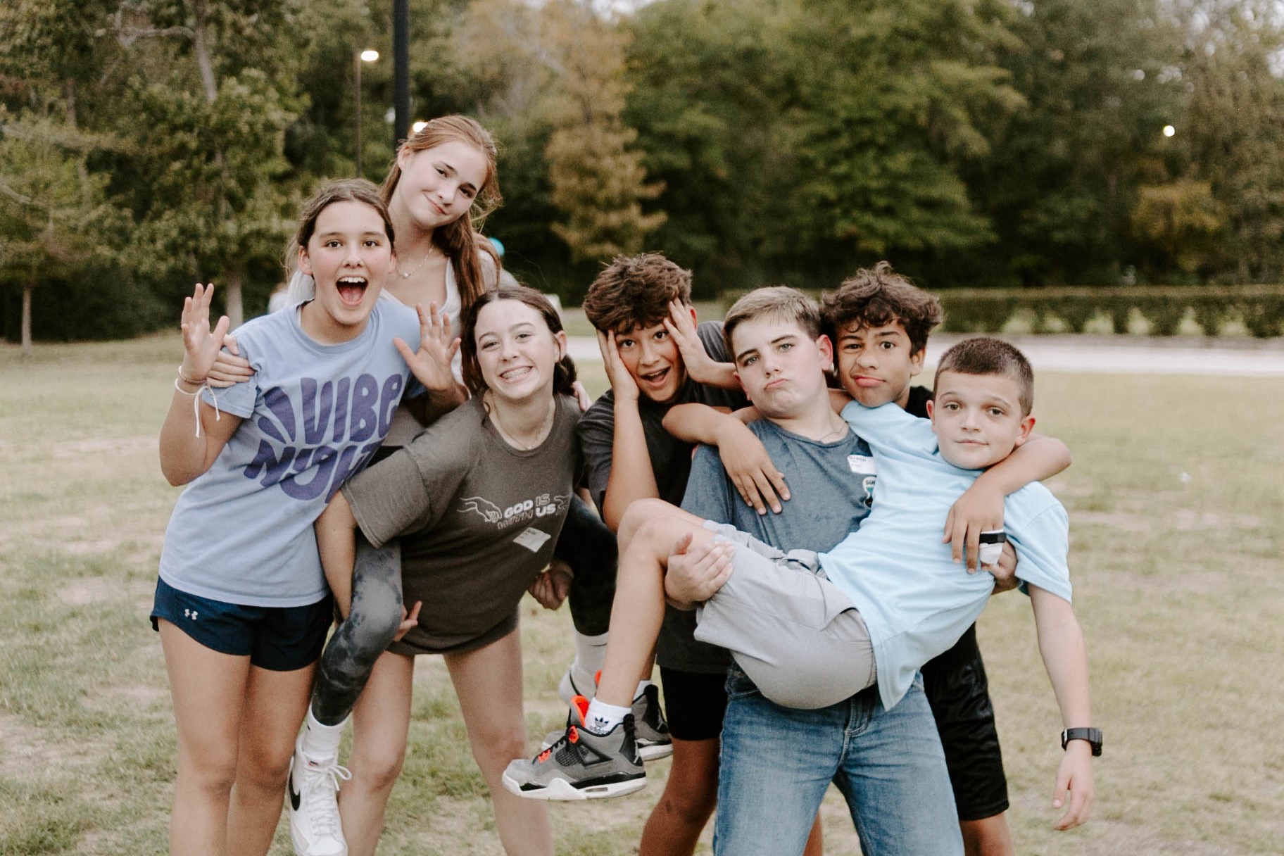 a youth pastor praying over youth